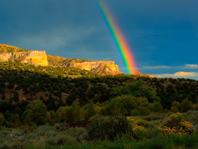 Rainbow over sandstone cliffs in Georgia O'Keefe country, New Mexico.