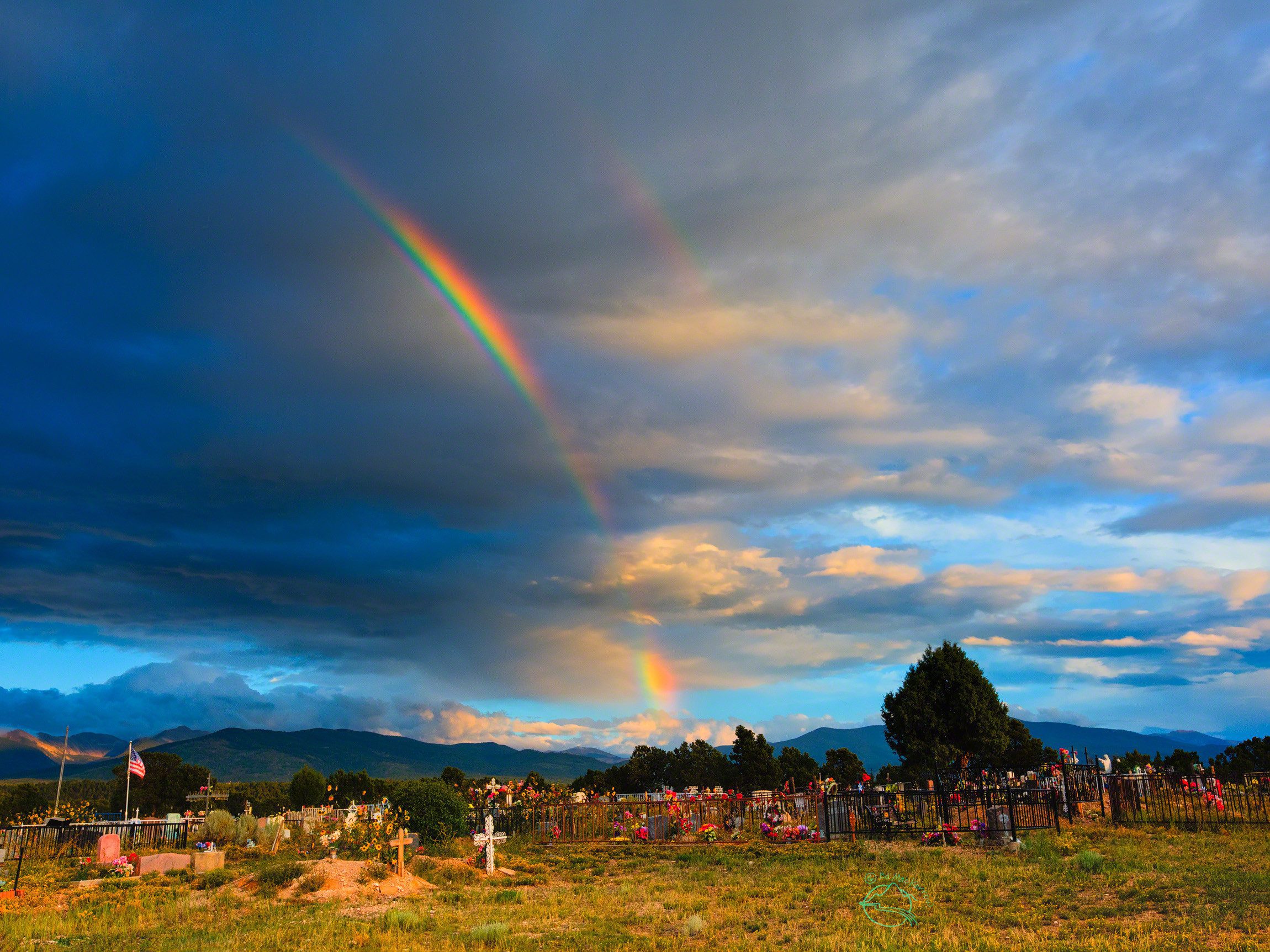 Rainbow over the cemetery at Truchas, New Mexico