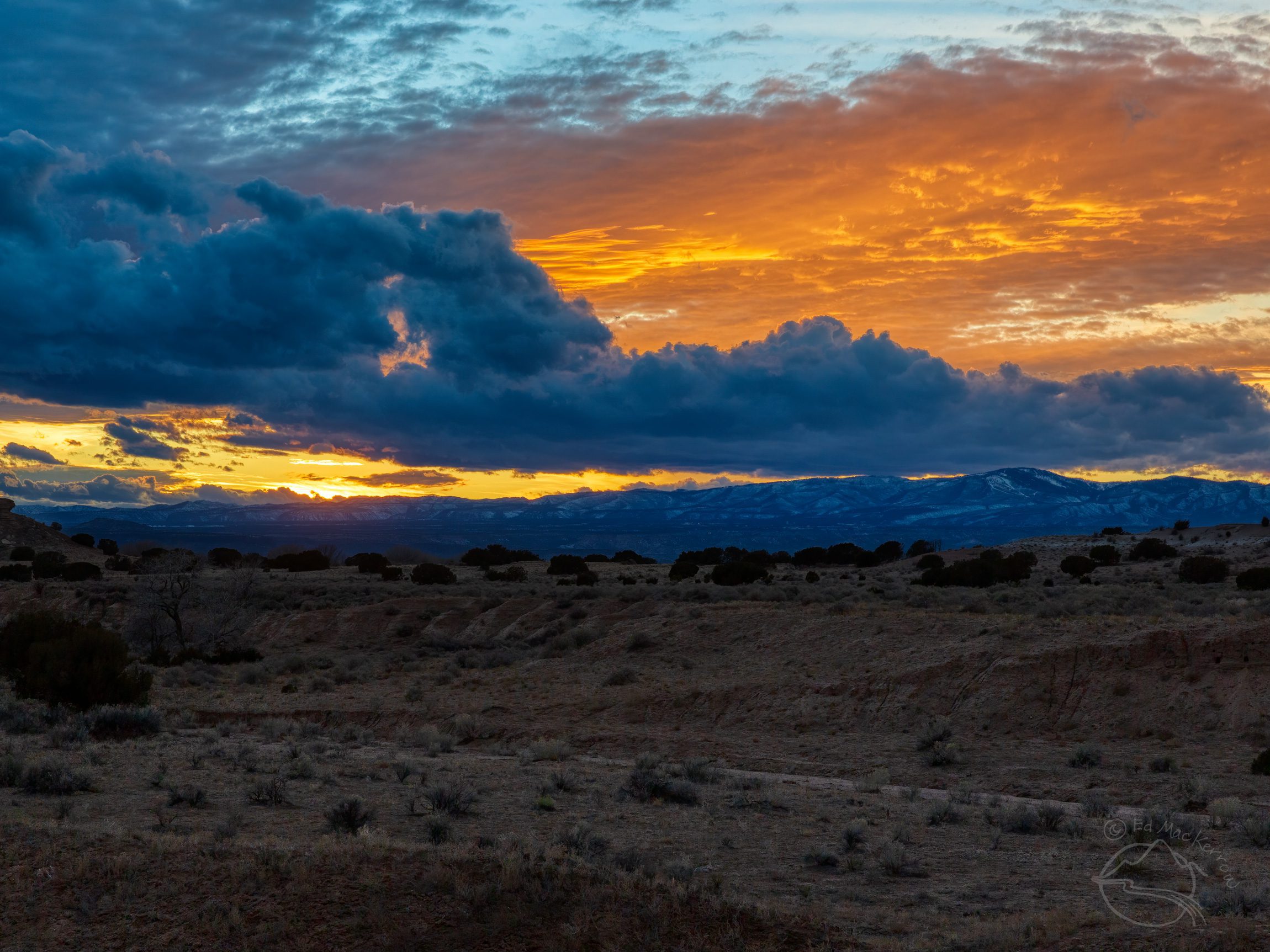 Stratocumulus clouds under cirrostratus clouds at sunset in New Mexico
