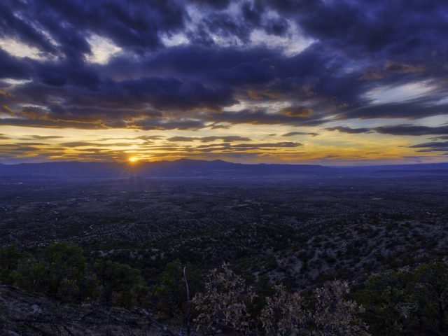 Sunset at Cloud Level over Santa Fe The setting sun underlights the clouds as seen from a mountain top in Santa Fe.
